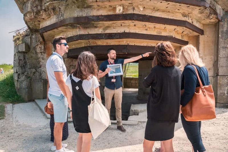 Caen: Guided D-Day Sites Tour & Caen Memorial Museum Ticket - Pointe du Hoc and the physical reality of the assault