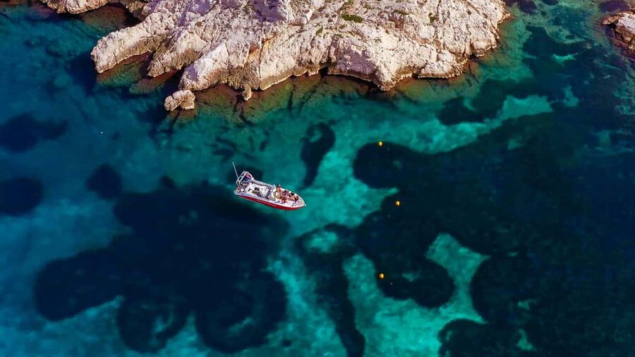 From Marseille: Iconic Calanques Boat Tour with Swimming - What the captain adds to the ride