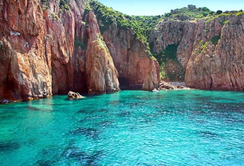 From Sagone/Cargèse: Piana, Scandola, Girolata Boat Tour - Omigna’s Genoese tower sets the scene