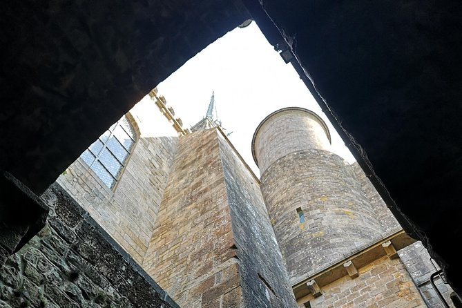 Mont Saint-Michel Day Trip from Bayeux (Shared tour) - Walking the village and climbing toward the abbey