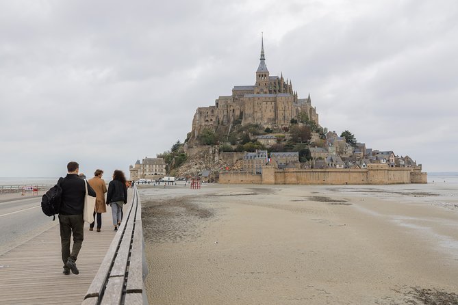 Mont Saint Michel Day Trip with Abbey Entrance from Paris - Climbing to the Benedictine abbey
