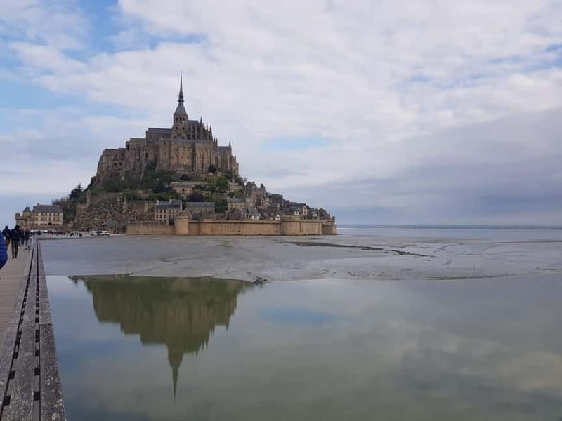 Mont Saint Michel: Village History and Legends Walking Tour - Meeting at the shuttle and reaching the island