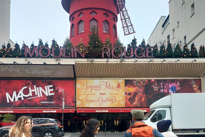Montmartre Hidden Gems and Scenic Highlights Walking Tour - Moulin de la Galette and the man through the wall