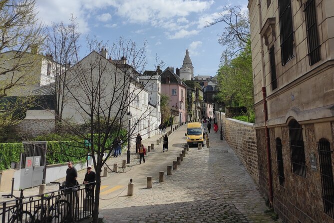 Montmartre Walking Guided Tour - Starting beneath the red windmill at Moulin Rouge