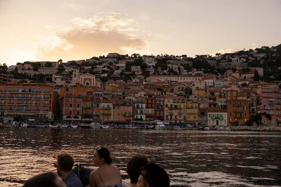 Nice: Sunset Boat Tour with Wine and Local Snacks - Wine, caramelized onion pizza, and Niçois snacks