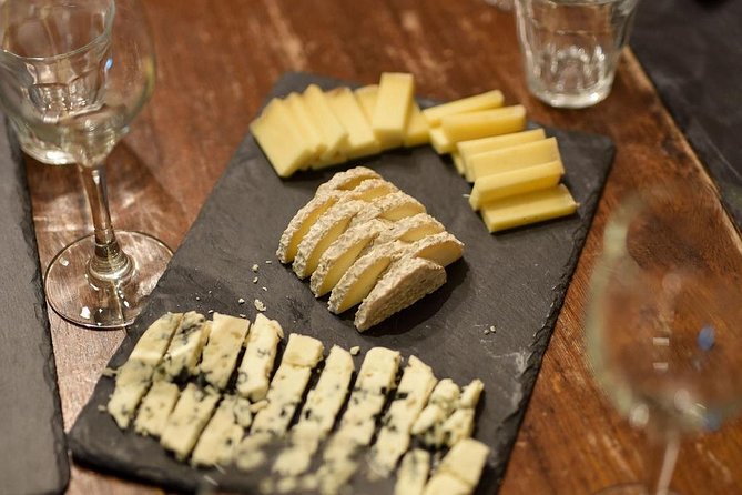 Paris Art of Pairing Cheese and Wine Tasting in a Cheese Cellar - Seven cheeses, cut fresh for the tasting