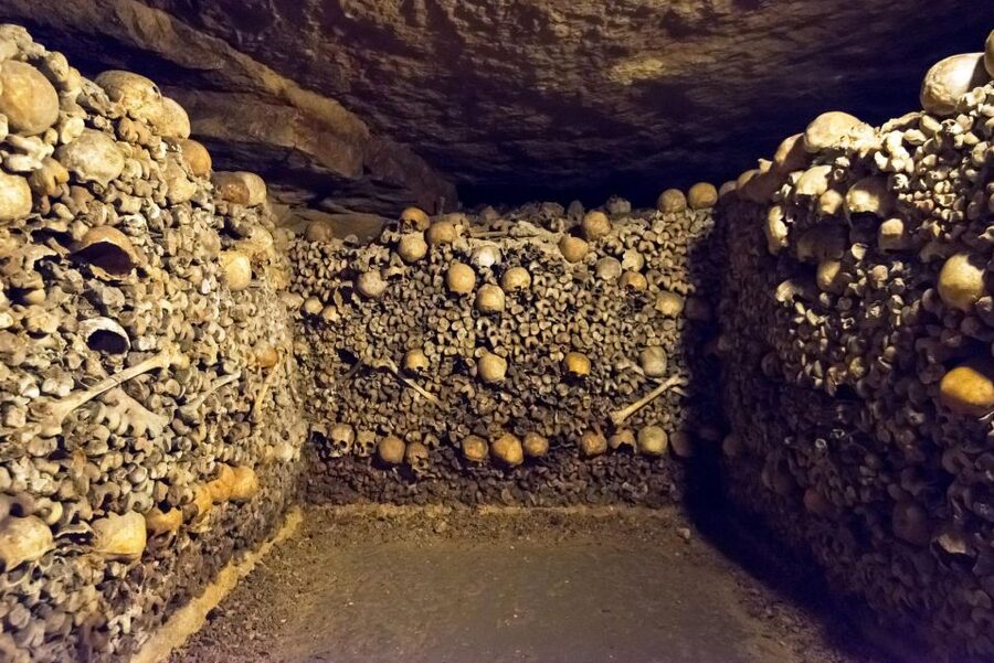Paris: Catacombs Ticket and Seine River Cruise - Inside the Catacombs: A Somber Walk Beneath Paris