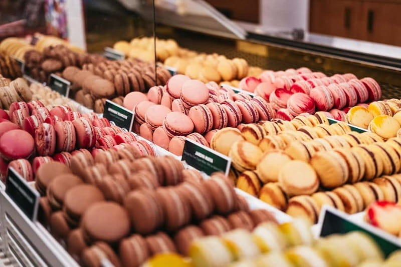 Paris: Chocolate & Patisserie Walking Tour with Tastings - Rue de Buci, cobblestones, and Left Bank character