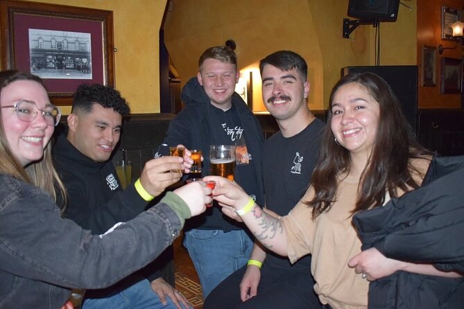 Paris: City Center Guided Pub Crawl with Shots & Club Entry - The Porte-Saint-Denis photo stop