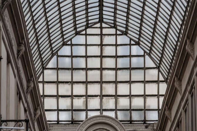 Paris Covered Passages Walking Tour plus Seine Cruise Option - Passage Jouffroy: glass, iron, and photographs