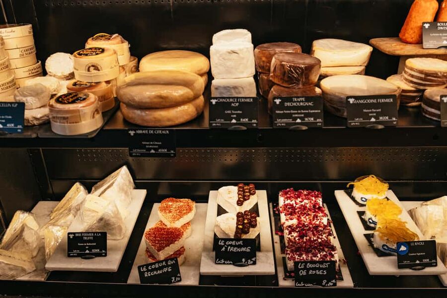 Paris: Gourmet Food Tour with Over 10 Tastings and Wine - Paris’s Famous Street Market and a Royal Food Connection