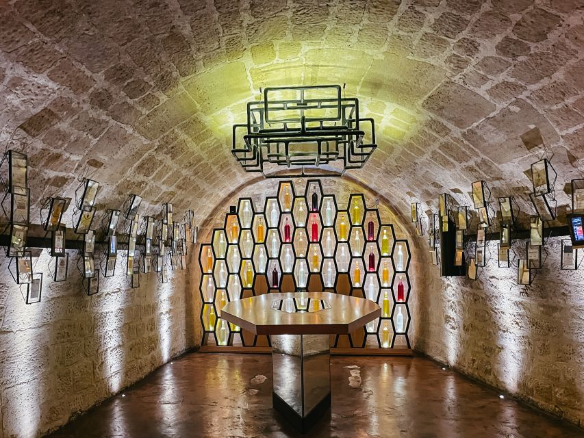 Paris: Les Caves du Louvre Guided Tour with Wine Tastings - The cellar rooms tell the first part of the story
