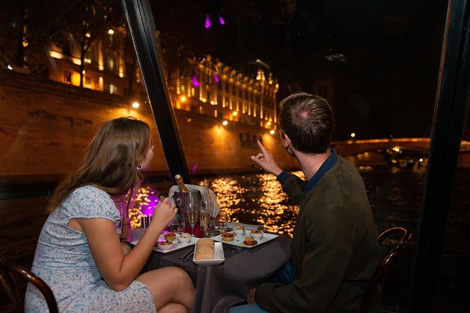 Paris Seine River Dinner Cruise with Champagne and Window Seating - Conciergerie and Notre-Dame from the river