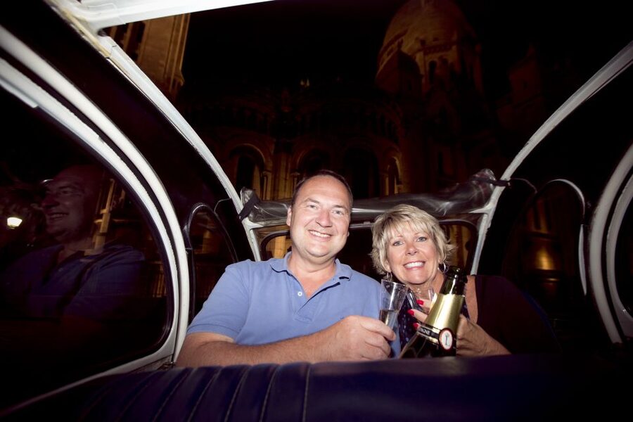 Private tour of Paris by Night with Champagne - Louvre, Notre Dame, and Opera Garnier after dark