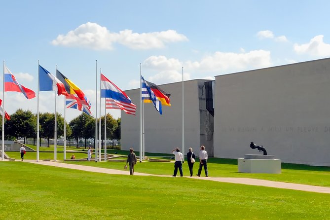 Small Group Guided D-Day Tour and Mémorial de Caen Museum - Omaha Beach puts the human cost at the center